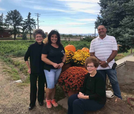 Pasqualine, Marie, Grace Ann, & Anthony pose for a picture before a Farm-to-Table dinner.